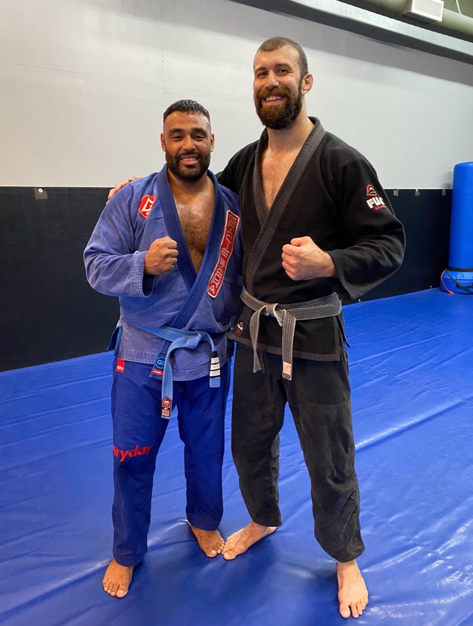 Frank Smith III with another jiu-jitsu practitioner on training mats