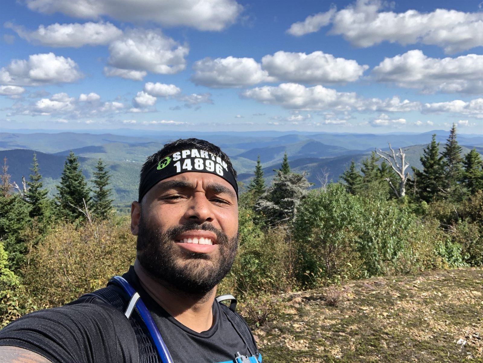 Frank Smith III outdoors in mountain hiking and Spartan training discipline