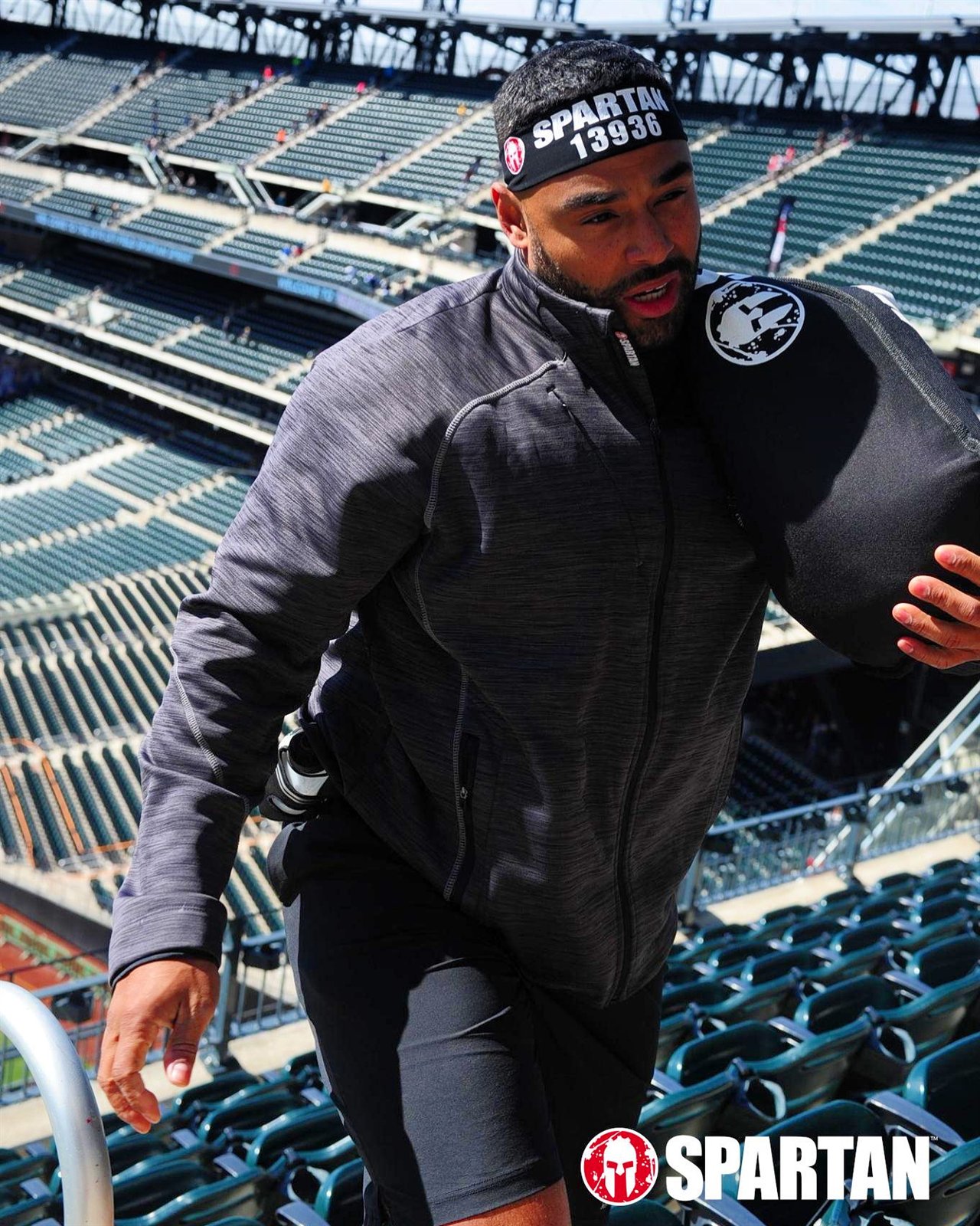 Frank Smith III running stadium stairs during a Spartan race